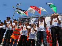 Palestinian children take part during a rally to mark the 7th anniversary of the Mavi Marmara Gaza flotilla incident, as they simulate the r...