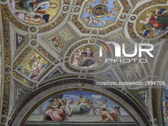 Visitors attend the inauguration of a new type of lighting from OSRAM in the Raphael’s Rooms at the Vatican Museums on June 01, 2017. The Ra...