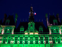 The Paris city hall on 1 June, 2017 is lightened in green « to mark the disapprobation » of the french capital and its socialist mayor Anne...