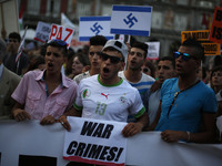 Protestors shout anti-israeli slogans as they attend a protest against the Israeli bombings in the Gaza strip, in Madrid, Thursday July 31,...