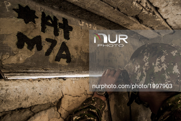 Soldier of Nagorno Karabakh army watches in the trenches close to Martakert frontline, less than 300 meters of the Azerbaijan army positions...