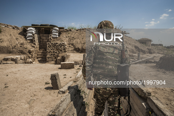 Soldier of Nagorno Karabakh army makes a patrol in the trenches close to Martakert frontline, less than 300 meters of the Azerbaijan army po...