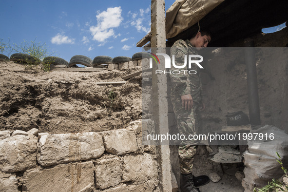 Soldier of Nagorno Karabakh army  prepares coffee in the trenches close to Martakert frontline, less than 300 meters of the Azerbaijan army...