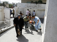 A wounded Palestinian man arrives at al-Najar hospital in the southern of Gaza strip, on August 1, 2014. Israeli shelling killed eight peopl...