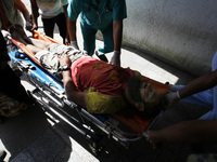 A wounded Palestinian man arrives at al-Najar hospital in the southern of Gaza strip, on August 1, 2014. Israeli shelling killed eight peopl...