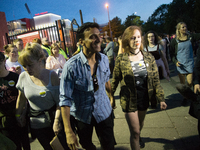 People leave the One Love Manchester stage at the Old Trafford cricket ground in Trafford, United Kingdom, Sunday, June 04, 2017. The One Lo...
