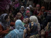 A Kashmiri woman cries during the funeral of a teenager Adil Magray at Shopian, about 60 kilometers (38 miles) south of Srinagar, Indian-adm...
