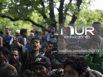 Kashmiri villager children shout pro-freedom slogans during the funeral of a teenager Adil Magray at Shopian, about 60 kilometers (38 miles)...