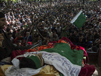 Kashmiri villagers attend the funeral of a teenager Adil Magray at Shopian, about 60 kilometers (38 miles) south of Srinagar, Indian-adminis...