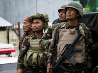 Philippine soldiers looking at a helicopter as they fight the Islamic rebels in Mindanao, Philippines on June 8, 2017. Philippine troops con...