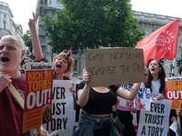 Dozens gather at Downing Street in London on June 9, 2017 to stage an anti-Theresa May demonstration. They demanded the prime minister resig...