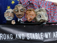 An effigy of British Prime Minister Theresa May and other politicals is seen before being used by anti-Brexit protesters in a demonstration...