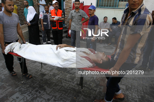A wounded Palestinian man arrives at the al-Kuwaiti hospital a after an Israeli air strike in Rafah, in the southern Gaza Strip on August 2,...