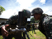 Philippine marines focus the target as they try to attack remaining Islamist rebels during a heavy fight inside Marawi city, southern Philip...