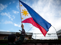 The Philippine National Police hang flags in war-torn Marawi City in preparation for the celebration of Independence Day on June 12, Lanao d...