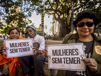 Women who held a posted with the phrase ''Women without Temer'' take a picture during a demonstration in Sao Paulo, Brazil, 11 June 2017. Th...