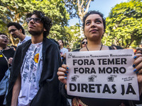 Women who held a posted with the phrase ''Women without Temer'' take a picture during a demonstration in Sao Paulo, Brazil, 11 June 2017. Th...