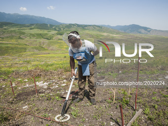 Deminer of HALO Trust organisation searches for landmines with  his metal detector in the hills of Nagorno Karabakh, on 13 June 2017. Mines...