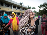 Muslim residents hides from the camera before a symbolic flag raising ceremony in celebration of the Independence Day in Marawi City, Philip...