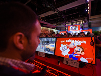 Attendees play Nintendo's Super Mario Odyssey during E3 Electronic Entertainment Expo at Los Angeles Convention Center on June 13, 2017 in L...