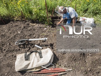 Deminer of HALO Trust organisation clears area around a landmine after checking with a metal detector in the hills of Nagorno Karabakh. Mine...