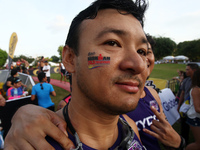 An athlete shows his Cobra Ironman 70.3 Philppines temporary tattoo on his face. This is the sixth Ironman triathlon event in the Philippine...