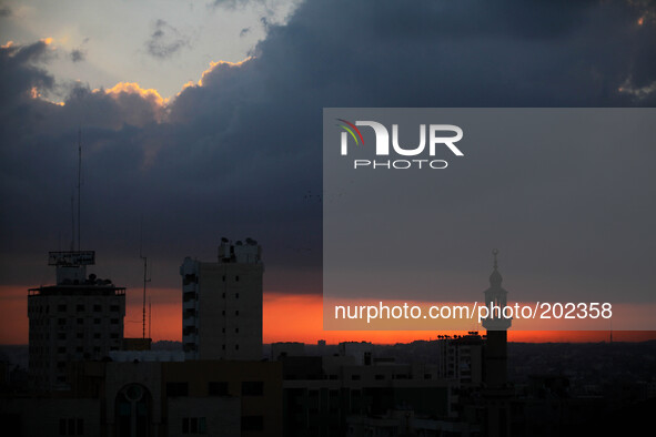 The sun rises over Gaza City, Sunday, Aug. 3, 2014. The Israeli military said Sunday that an Israeli soldier it previously believed had been...