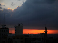 The sun rises over Gaza City, Sunday, Aug. 3, 2014. The Israeli military said Sunday that an Israeli soldier it previously believed had been...
