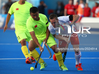 E Liguang of China  holds of Barry Middleton of England
during The Men's Hockey World League 2017 Group A match between England and Chinaat...