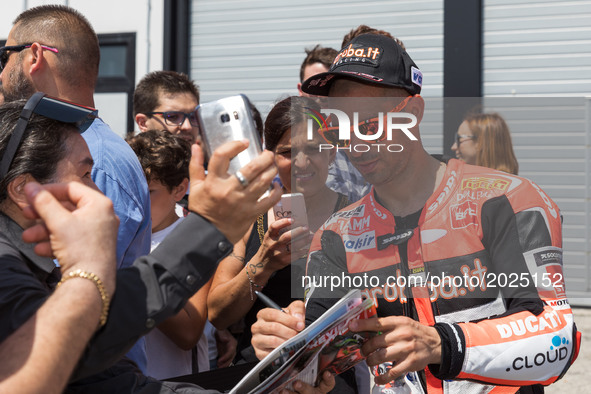 Marco Melandri of Aruba.it Racing - Ducati sign autographs after the free practice of the Motul FIM Superbike Championship, Riviera di Rimin...