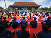 Sri Lankan participants perform Yoga during an event to mark the International Yoga Day at the Independence Square, Colombo, Sri Lanka on Sa...