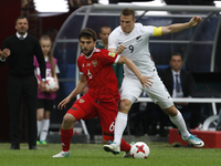Georgy Dzhikya (L) of Russia national team and Chris Wood of New Zealand national team vie for the ball during the Group A - FIFA Confederat...