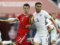 Dmitry Poloz (L) of Russia national team and Michael Boxall of New Zealand national team during the Group A - FIFA Confederations Cup Russia...