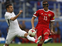 Fedor Kudriashov (R) of Russia national team and Kosta Barbarouses of New Zealand national team during the Group A - FIFA Confederations Cup...