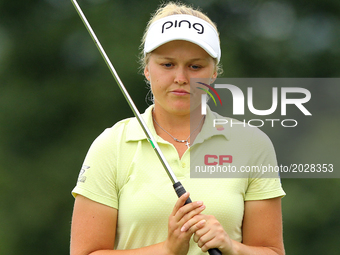 Brooke M. Henderson of Canada reacts after her shot on the 9th green during the third round of the Meijer LPGA Classic golf tournament at Bl...