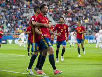 Spanish players celebrate after first goal during the UEFA Under 21 Championship Group B match between Spain and FYR Macedonia at Gdynia Sta...