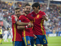 Saul Niguez of Spain celebrates his score with his team-mate during the UEFA Under 21 Championship Group B match between Spain and FYR Maced...