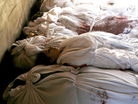The bodies during the funeral of at least 9 members of the same al-Ghul family who died after their house was hit by an Israeli air strike o...