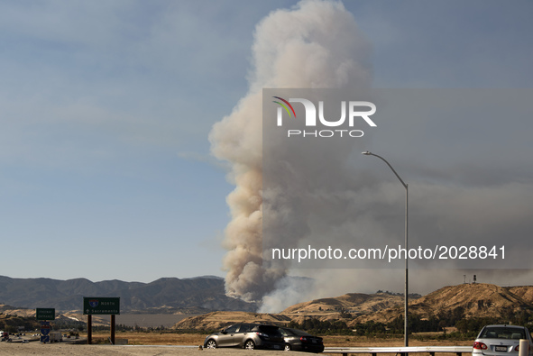 The Castaic Lake wildfire is seen from the 5 Freeway in Castaic, California on June 17, 2017. Castaic, California on June 17, 2017. Firefigh...