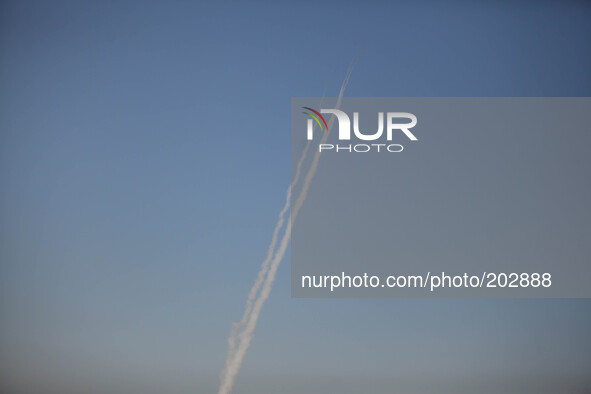 A smoke trail is left by a missile fired by Palestinian militants from the northern Gaza Strip on August 3, 2014. At least 10 people were ki...