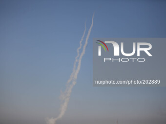 A smoke trail is left by a missile fired by Palestinian militants from the northern Gaza Strip on August 3, 2014. At least 10 people were ki...