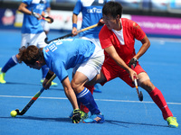 LEE Seunghoon of Korea  holds of SU Jun of China 
 during The Men's Hockey World League Semi-Final 2017 Group A match between China and Kore...