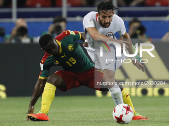 Collins Fai (L) of Cameroon national team and Mauricio Isla of Chile national team during the Group B - FIFA Confederations Cup Russia 2017...