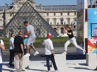 Jennifer Lopez and Her boyfriend Alex Rodriguez walk through the park of Jardin des Tuileries and seen taking pictures with the Pyramide of...