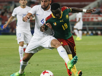 Collins Fai (R) of Cameroon national team and Mauricio Isla of Chile national team during the Group B - FIFA Confederations Cup Russia 2017...