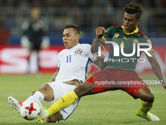Eduardo Vargas (L) of Chile national team and Adolphe Teikeu of Cameroon national team during the Group B - FIFA Confederations Cup Russia 2...