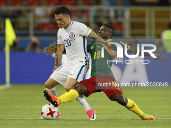 Eugenio Mena (L) of Chile national team and Collins Fai of Cameroon national team during the Group B - FIFA Confederations Cup Russia 2017 m...