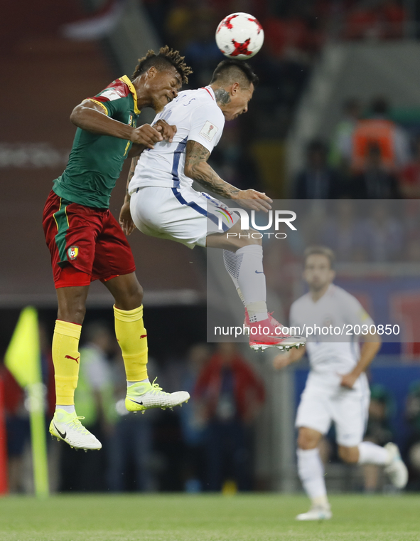 Adolphe Teikeu (L) of Cameroon national team and Eduardo Vargas of Chile national team vie for a header during the Group B - FIFA Confederat...