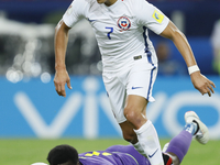 Alexis Sanchez (in front) of Chile national team and Fabrice Ondoa of Cameroon national team during the Group B - FIFA Confederations Cup Ru...