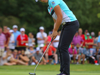 Brooke M. Henderson putts on the 18th green during the final round of the Meijer LPGA Classic golf tournament at Blythefield Country Club in...